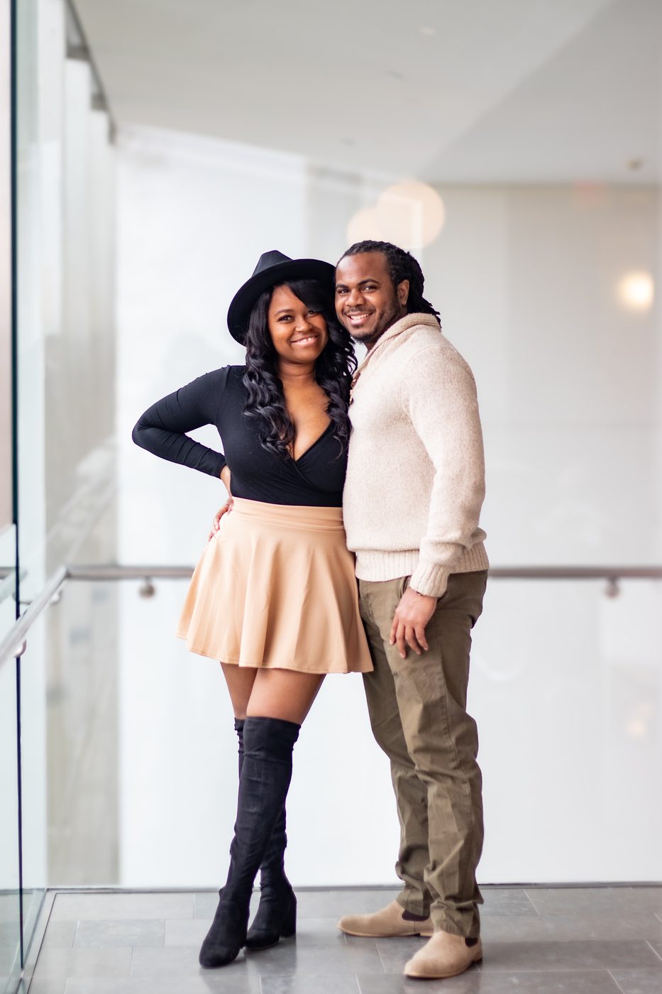Stylish couple portrait in a modern gallery