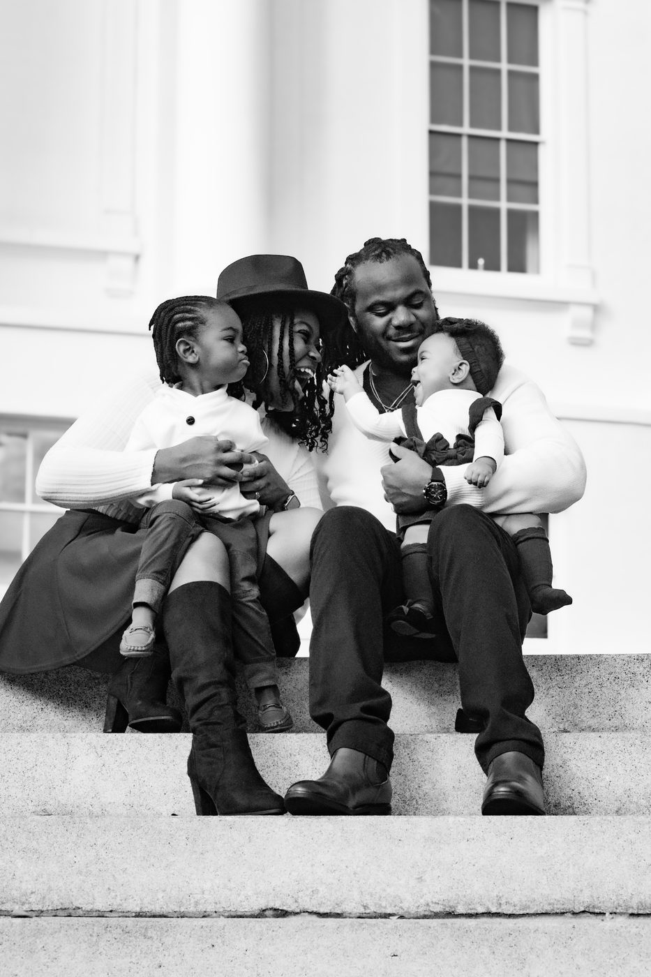 Black and white family portrait on museum steps