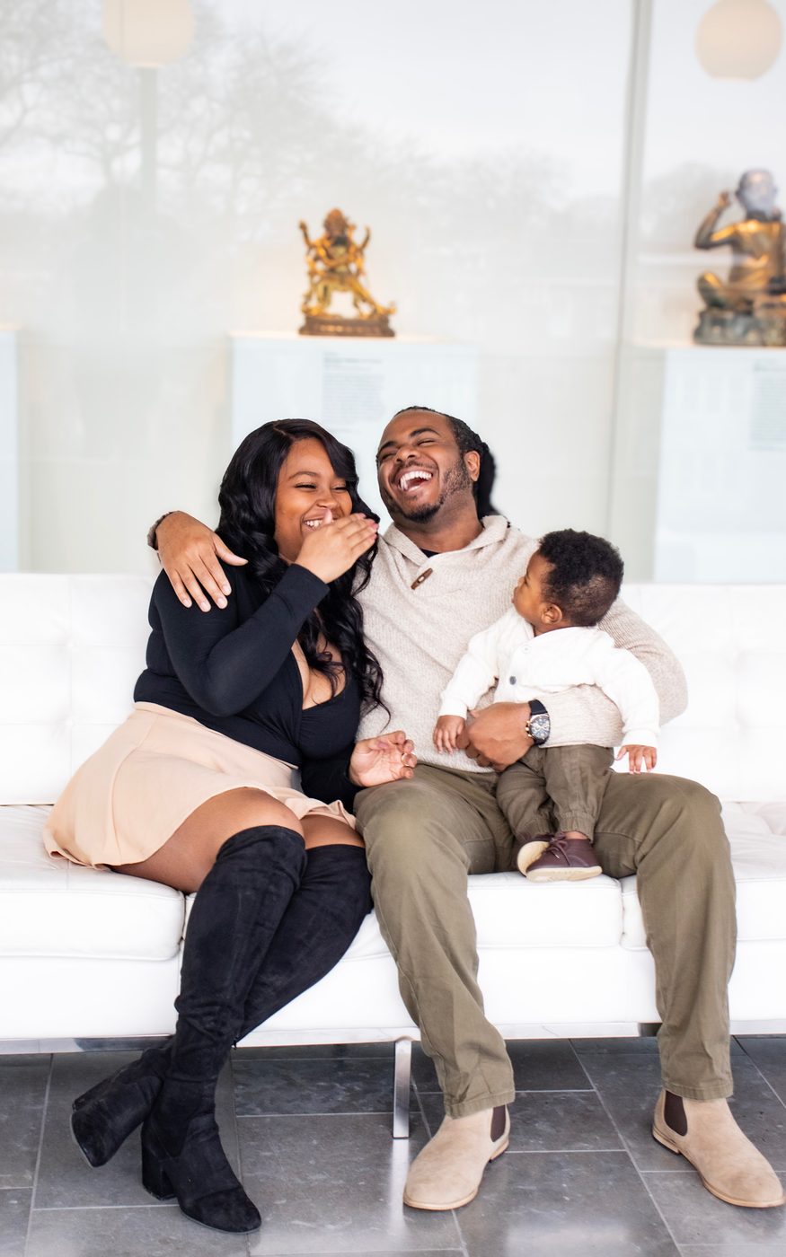 Young family laughing together during a lifestyle session