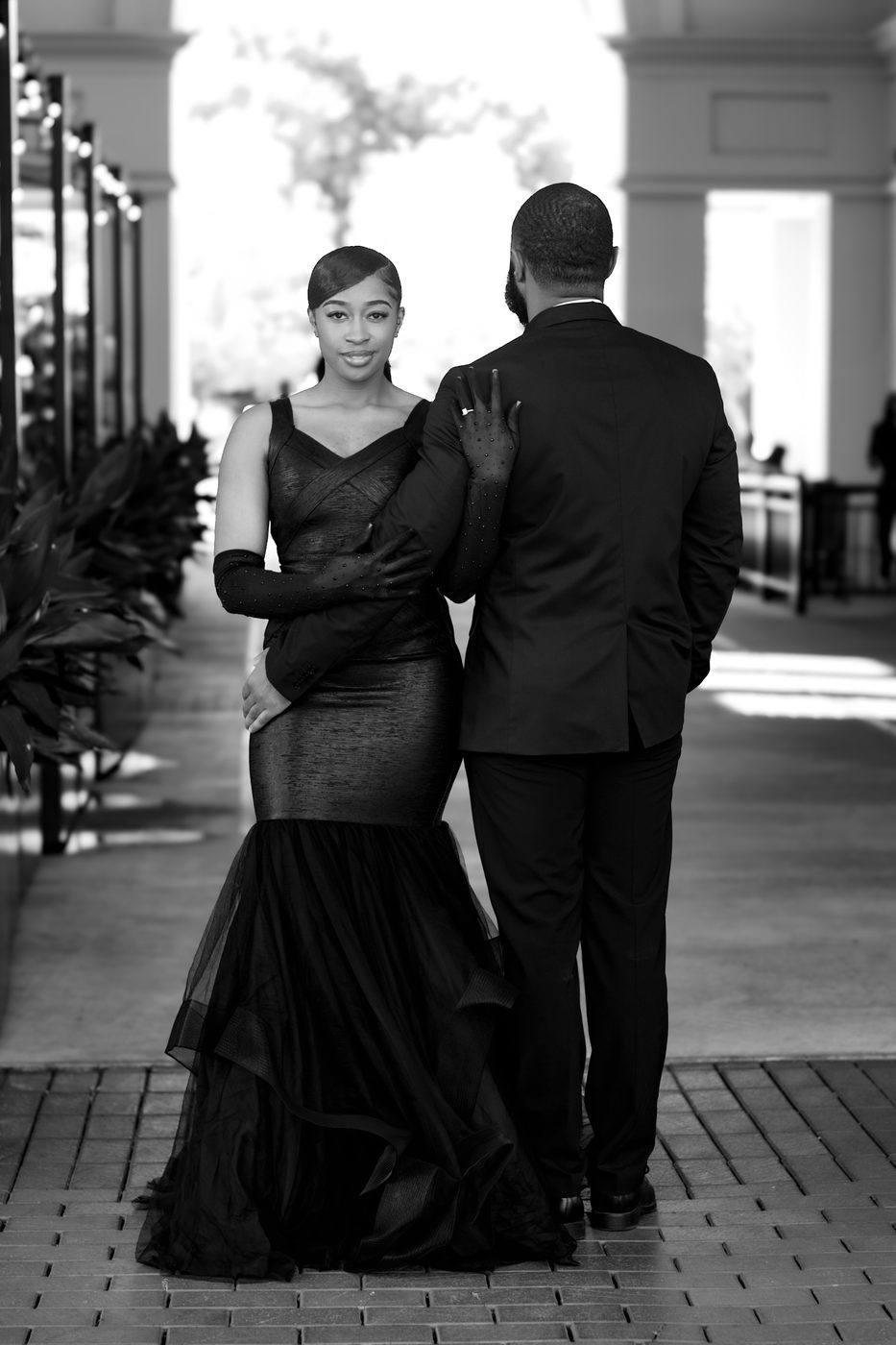 Elegant gown portrait with beaded gloves in black and white