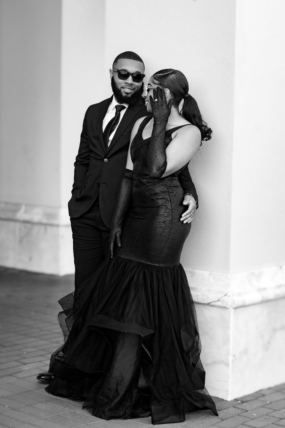 Editorial black and white couple portrait with sunglasses